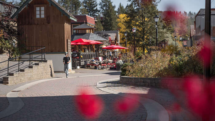 A man walking through a pedestrian area in Kimberley, British Columbia.